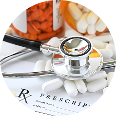Stethoscope, prescription medications, and prescription form representing healthcare and prescription assistance